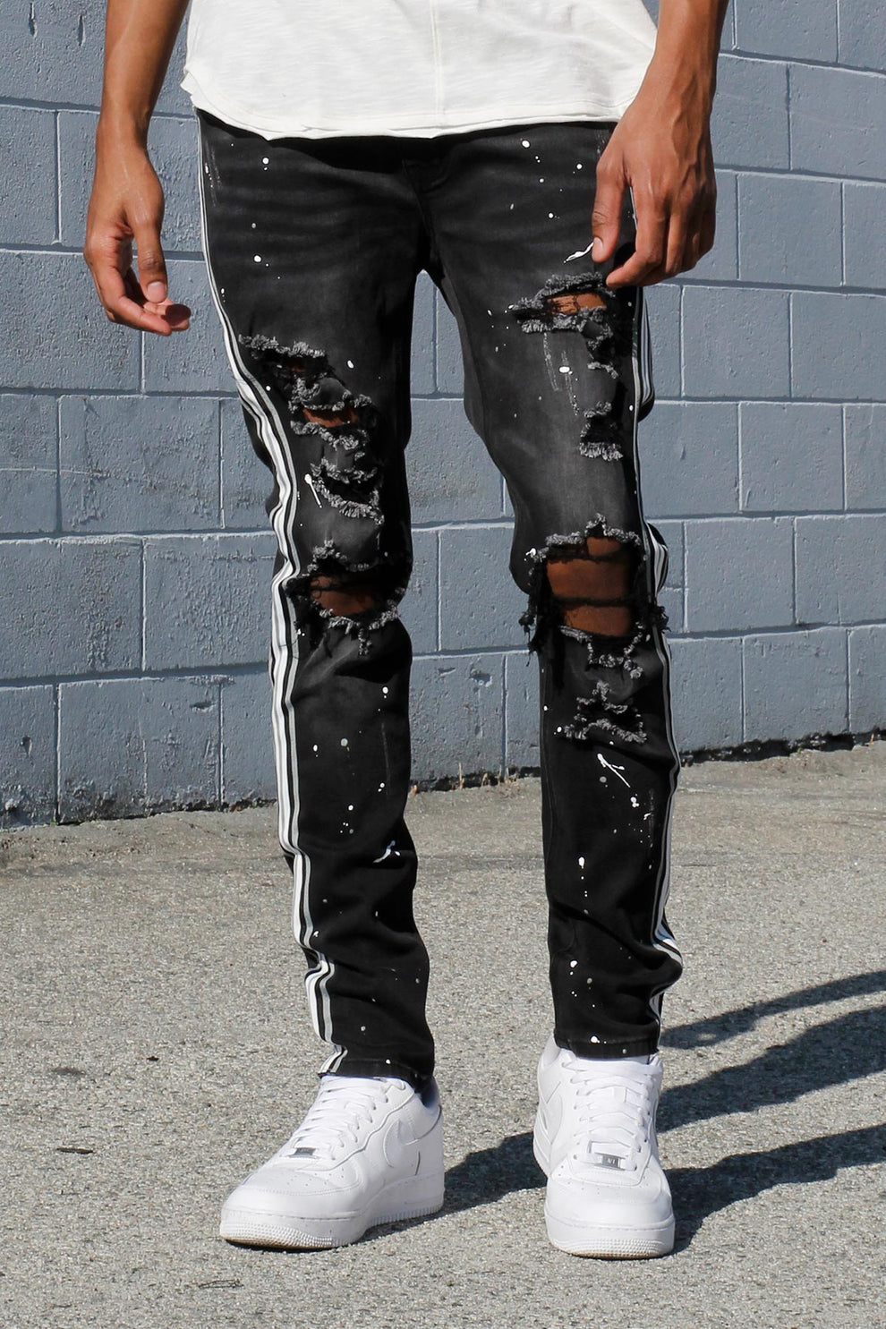 MULTI STRIPED PAINT SPLATTERED JEANS
