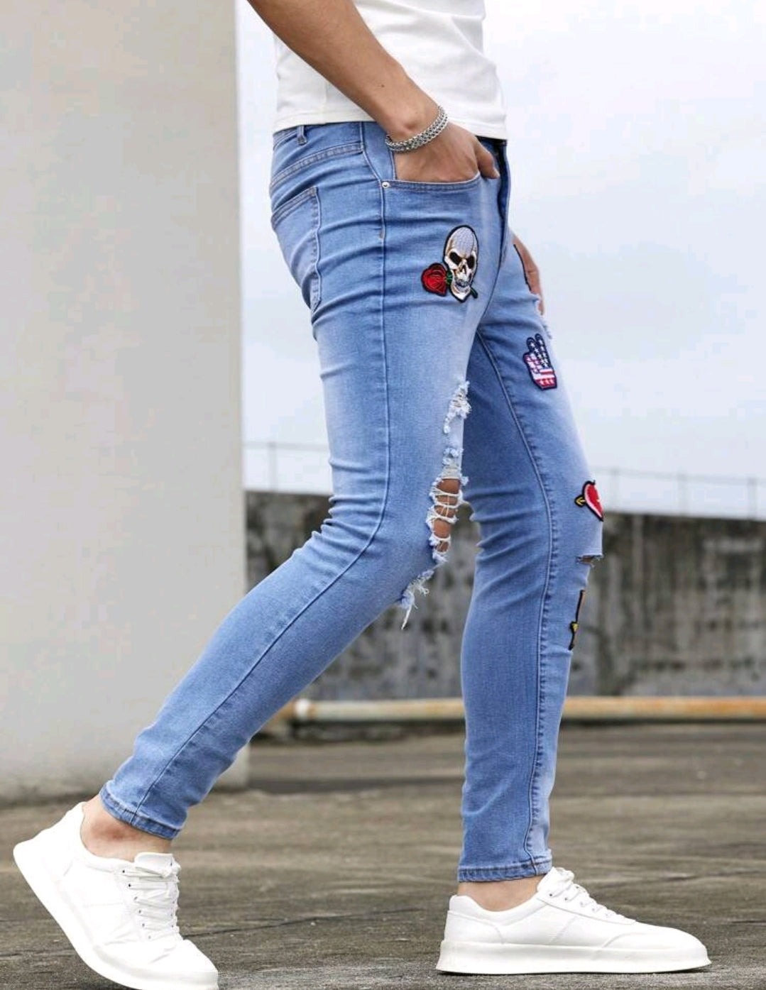 HEART AND SKULL PATCHED RIPED SKINNY JEANS